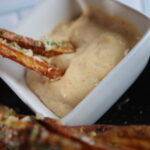 Fries dipped in mac sauce
