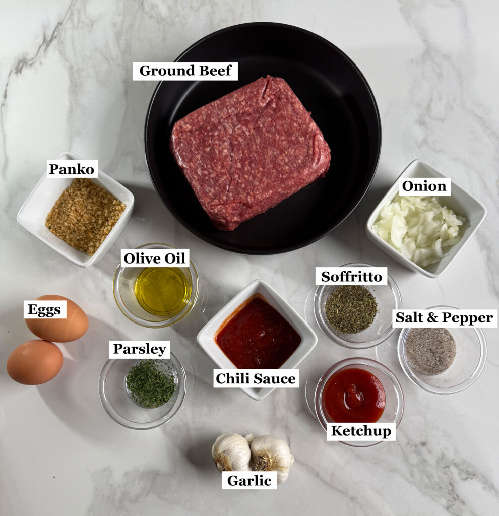 Meatloaf ingredients in cups and bowls