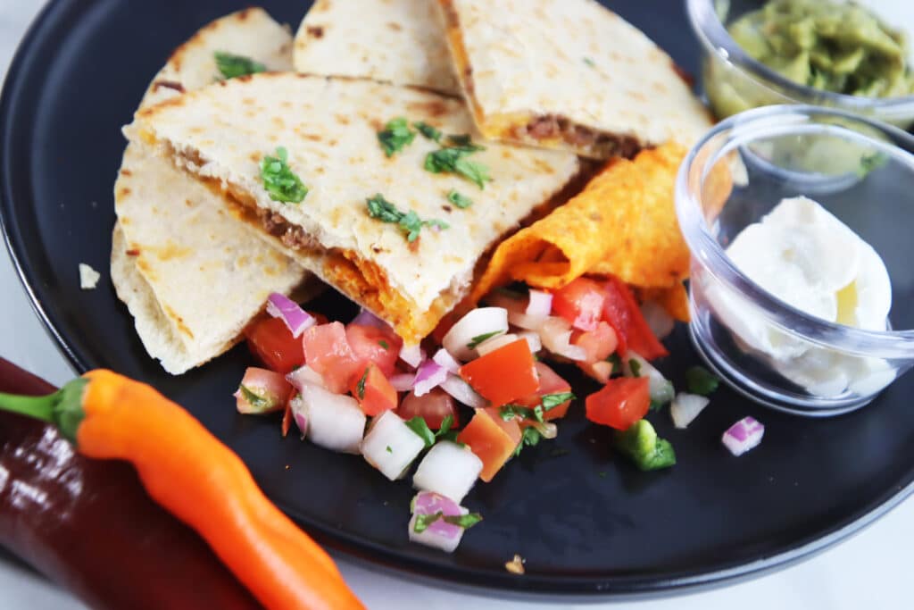 Doritos Quesadilla on plate with toppings