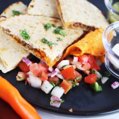 Doritos Quesadilla on plate with toppings